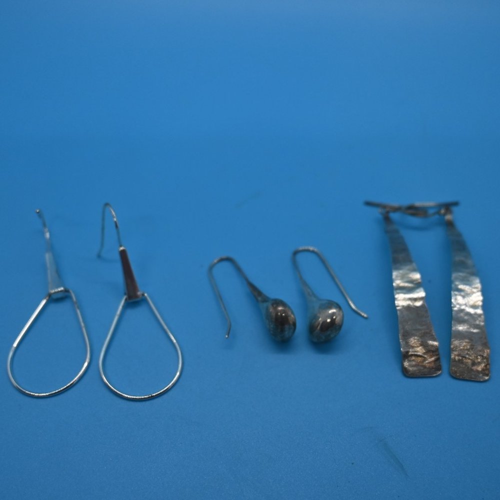 Three pairs of SS pierced earrings.